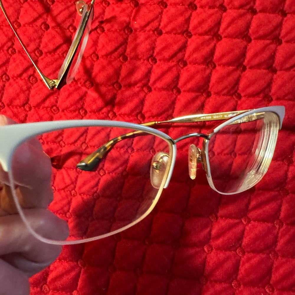 Prada Women's Black and Gold Frame Glasses